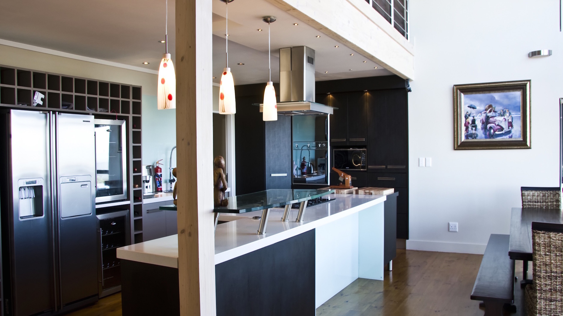 Kitchen and living space with an integrated television